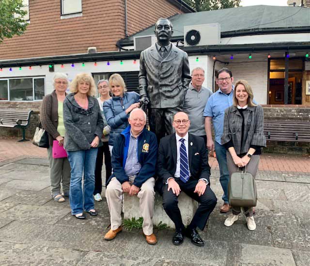 Members of Crowborough Rotary Club with the statue of Arthur Conan Doyle at Crowborough Cross