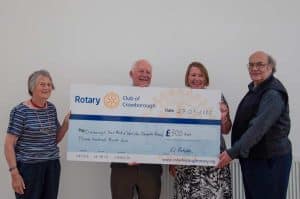 Cheque being presented to local charties