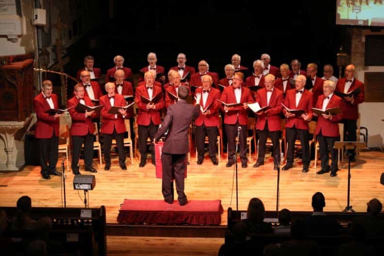 Royal Tunbrdge Wells Male Voice Choir performing on stage