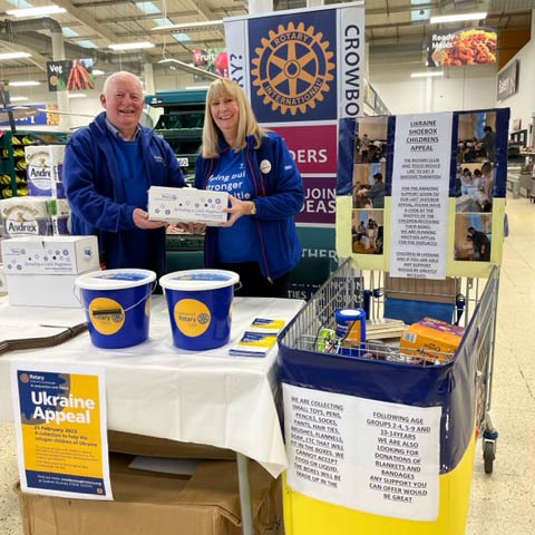 Rotary President Graham with Tesco's Amy on the Ukraine display